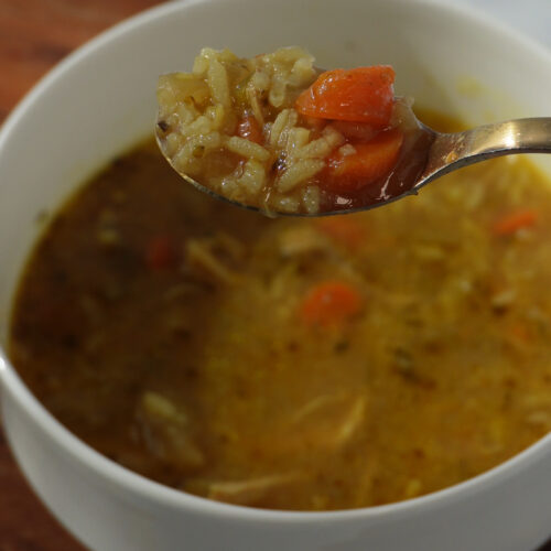 This hearty, comforting chicken and rice soup is packed with flavor from well-seasoned bone-in, skin-on chicken thighs, aromatic vegetables, and a rich, golden broth infused with turmeric, Cajun spices, and herbs.