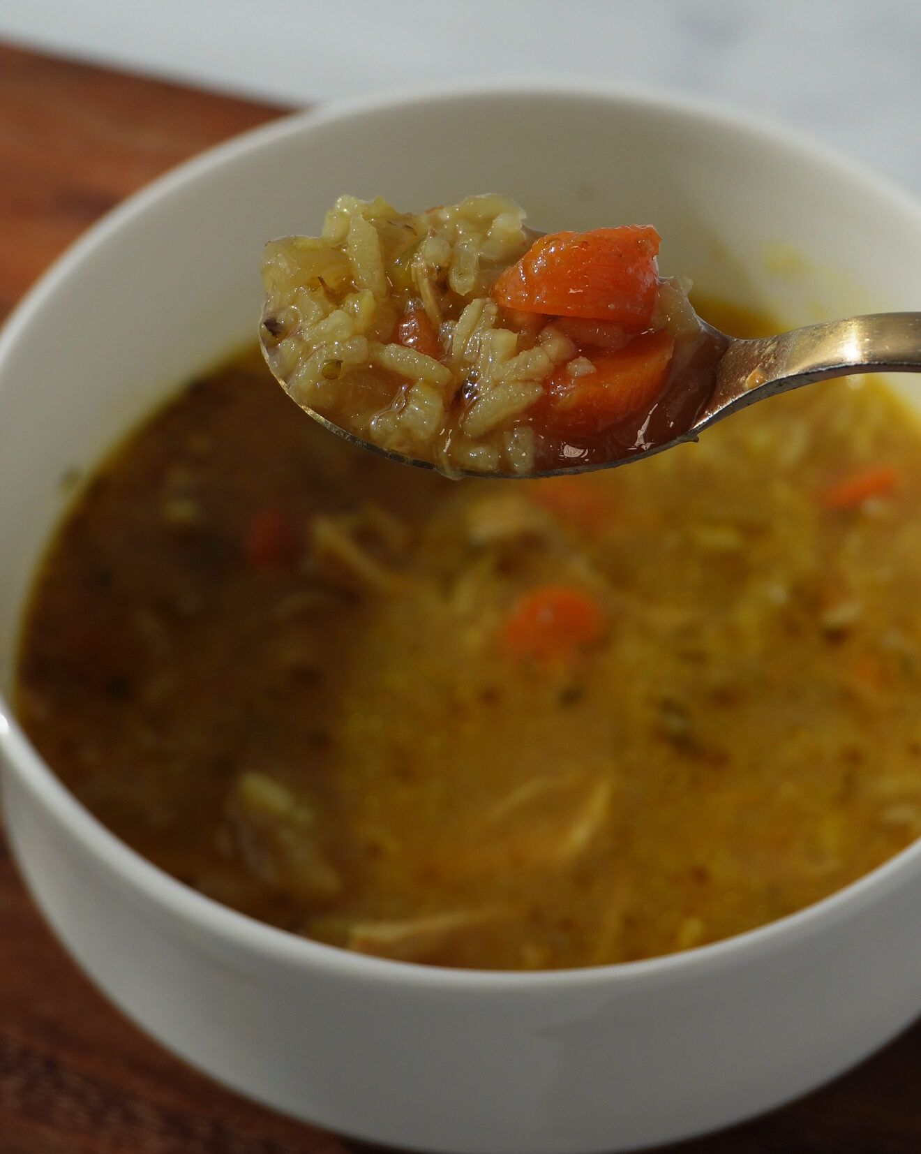 This hearty, comforting chicken and rice soup is packed with flavor from well-seasoned bone-in, skin-on chicken thighs, aromatic vegetables, and a rich, golden broth infused with turmeric, Cajun spices, and herbs.